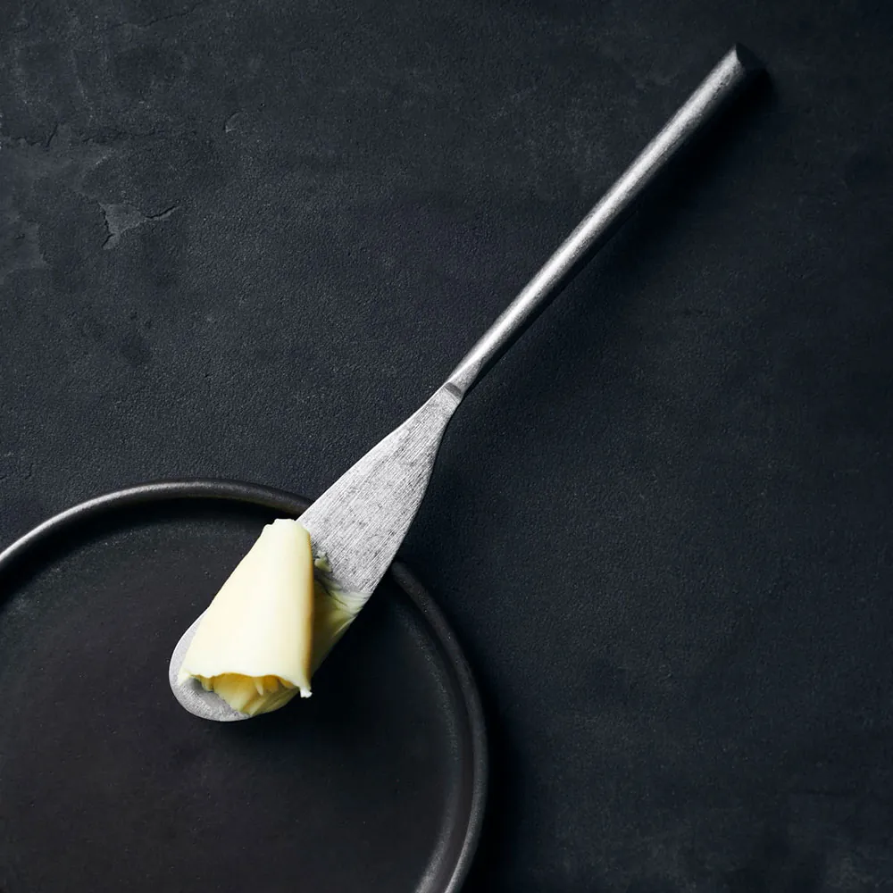 Smørekniv i rustfrit stål med smør